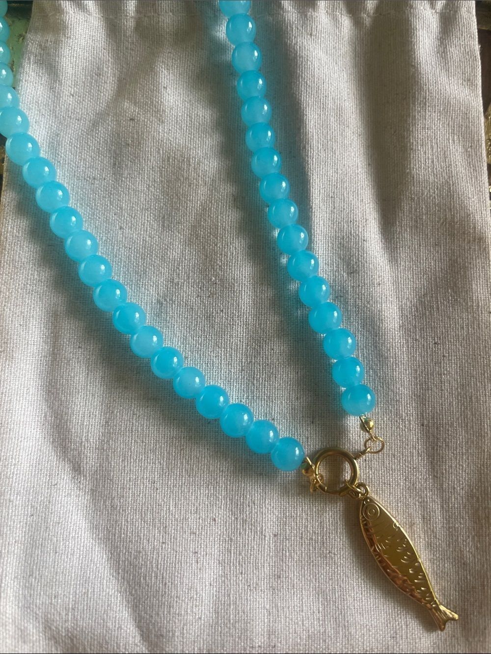 15.5” Turquoise Blue Beaded Necklace with Gold Fish Pendant
